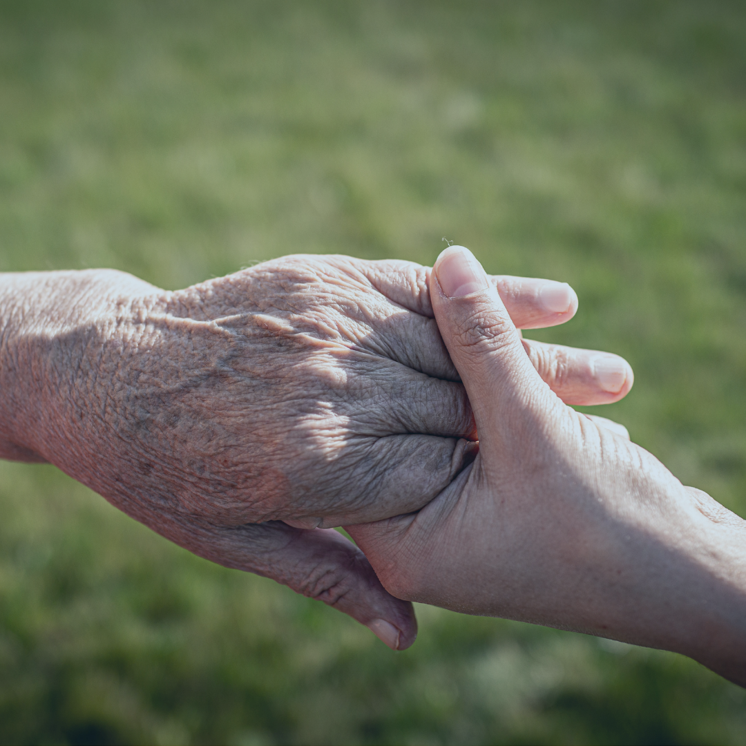Two people grabbing hands.