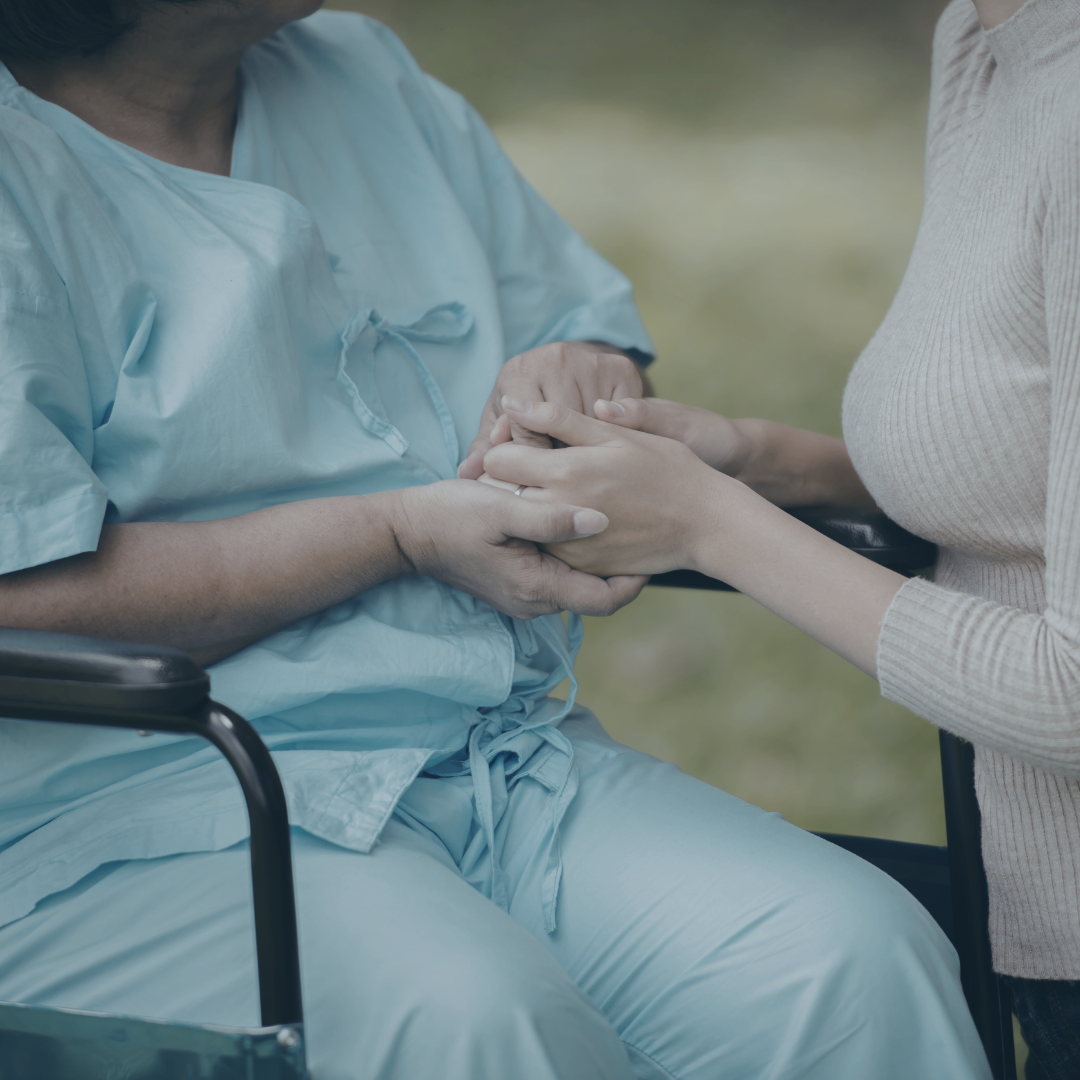Two people each others holding hands